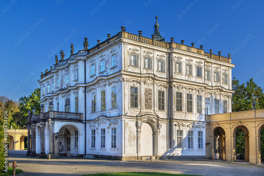 Fototapeta premium Ploskovice Castle, Czech Republic. Side view of Baroque palace facade under clear sky in bright daylight.