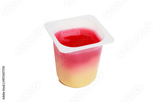 Fotografi A transparent cup with vanilla and raspberry pudding, isolated on a white background