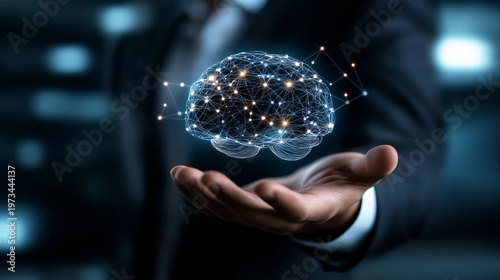 Businessman hand holding a glowing digital brain