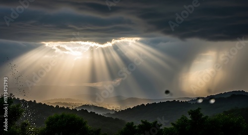 Dramatic Sunlight Bursting Through Clouds Over Rolling Hills.