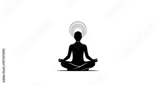 Silhouette of a person meditating in lotus pose with radiating aura, representing inner peace and mindfulness.