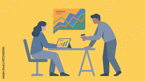 Two business colleagues analyzing data on laptop.