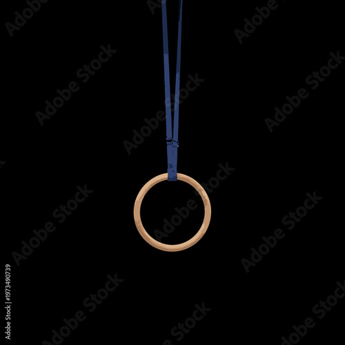A single gymnastic ring suspended in mid-air. The ring is a warm, natural tone, with a single, blue rope