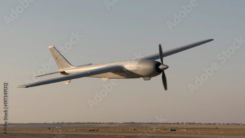 Taken low angle looking glider aircraft mid-flight futuristic unmanned aerial vehicle uav sleek metallic silve