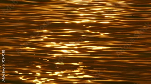 Golden waves background Bokeh sun glare reflection of Sunset sunrise light in water surface