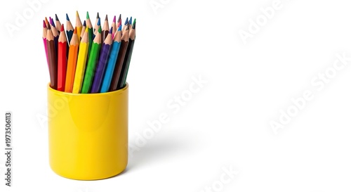 Colorful pencils in a glass cup for drawing and school use