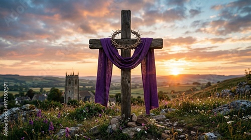 Sunrise Devotion: A solemn cross stands silhouetted against a radiant dawn sky, draped with a purple cloth and a crown, set atop a gentle hillside overlooking a picturesque village.