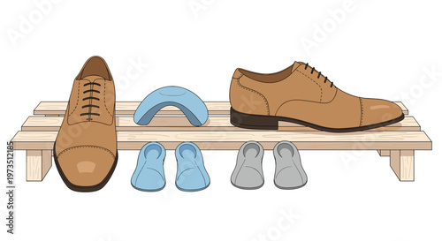A pair of polished tan leather oxford dress shoes rests on a light wooden slat rack next to several ergonomic blue and grey orthotic insoles for comfort.