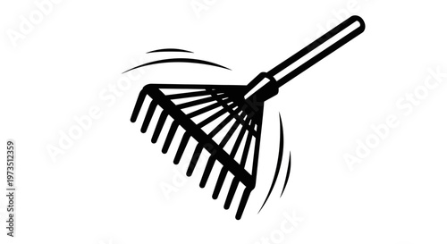 A black-handled rake with long evenly spaced metal tines is being used to gather leaves or debris in a yard or garden area, suggesting outdoor yard work or gardening activity during daylight hours.