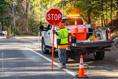 Photos Road Worker Holding Stop Sign Regulating Traffic Flow