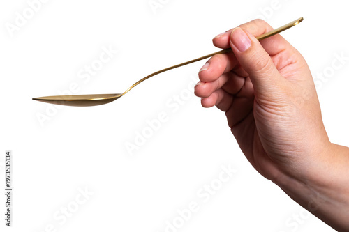 isolated of a women's hand holding a golden steel spoon with clipping path.