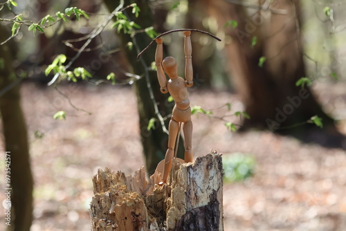 wooden mannequin in the woods.