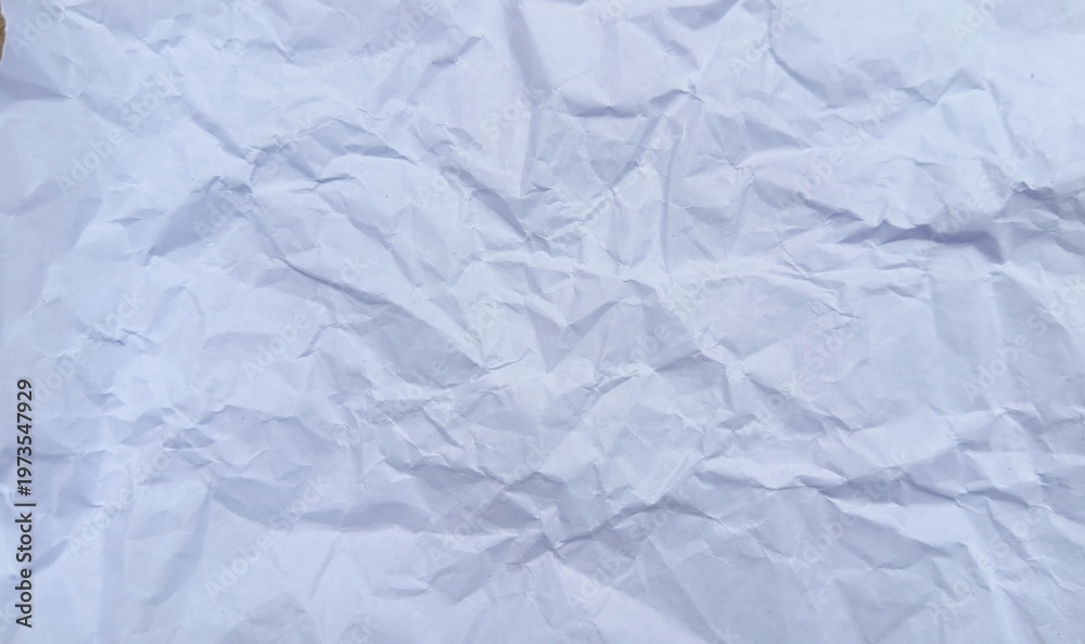Fototapeta premium Textured surface of crumpled white paper offering a unique tactile visual experience with light and shadow