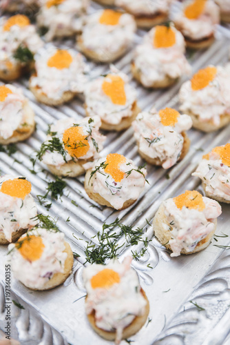 Quadro em tela Delicious Swedish Skagenröra appetizers on toasted bread rounds, topped with bright orange bleak fish roe and fresh dill