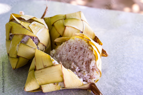Freshly cooked Filipino puso rice, wrapped in coconut leaves. Puso, or hanging rice, is a traditional Filipino delicacy from Cebu and the Visayas region