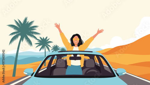 Happy woman standing up in a blue convertible car with her arms raised while driving along a coastal road with palm trees and dunes.