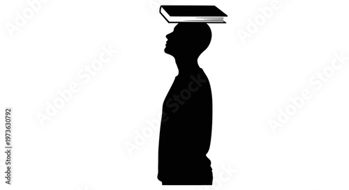 Man balancing book on his head.