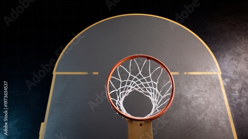 Basketball hoop and net viewed from above, highlighting the playing area and structure on a dark background