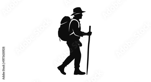 Silhouette of a male hiker with a backpack and walking stick.
