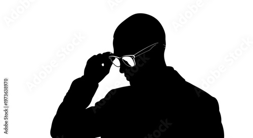 Silhouette of a man adjusting his eyeglasses deep in thought or observation.