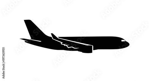 Silhouette of a passenger airplane in flight.