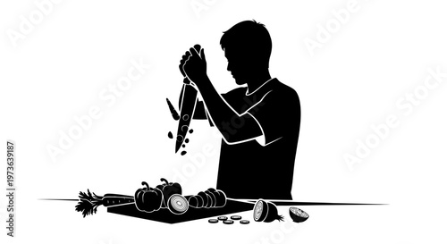 Silhouette of a person chopping vegetables with a knife on a cutting board.