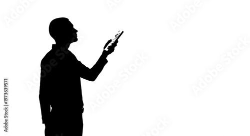 Silhouette of man holding smartphone 1.