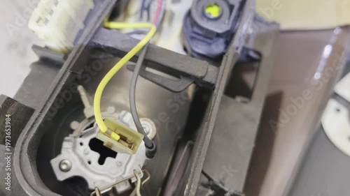 Repair of a broken device with focus on wiring and connection in a workshop environment