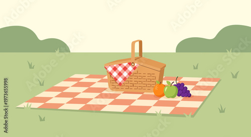 Summer Picnic Basket with Fruits on a Checkered Blanket in a Grassy Field