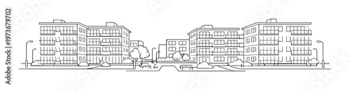 Residential buildings around small park and benches on street