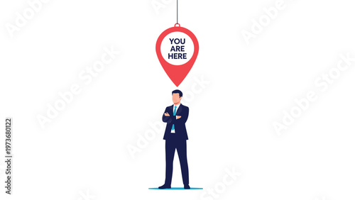 Businessman stands under large red location pin with you are here text representing identity and positioning.