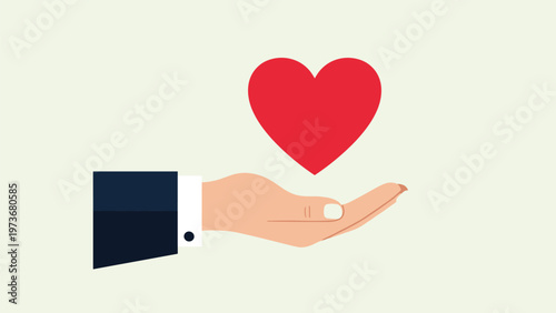 Businessman hand gently holding a bright red heart symbol representing love health charity and emotional support concept.