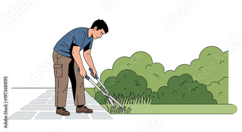 Gardener trims grass with shears on paved path next to lush green bushes