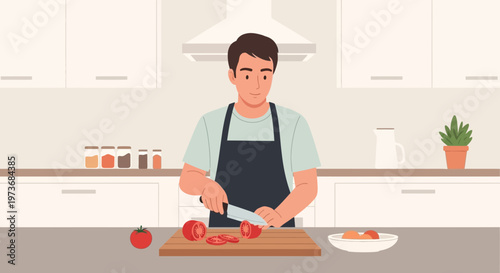 Man chopping tomatoes in a modern kitchen, preparing food for a meal.