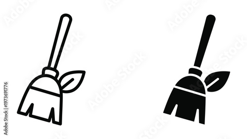 Two contrasting brooms with leaf-shaped handles depicted in black and white