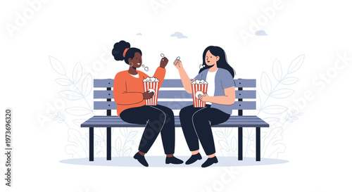 Two young women sit together on a wooden park bench sharing a bucket of popcorn and enjoying a conversation outdoors.