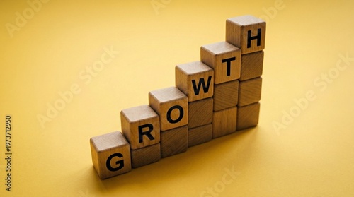 Business Growth Staircase: Wooden blocks spelling GROWTH are arranged in a rising staircase pattern, symbolizing upward progression and development against a bright yellow background.
