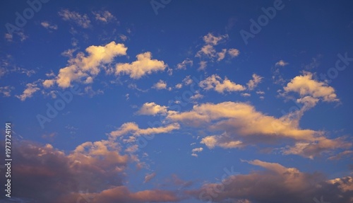 Beautiful sky view at sunset with scattered clouds, Bright blue sky This atmospheric view captures the natural beauty and dynamic lighting of the sky.