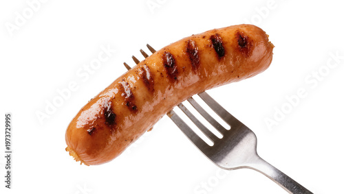 Grilled sausage on fork with char marks and meaty texture