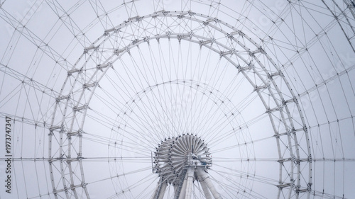 Quadro su tela Snow falls gently over a massive Ferris wheel