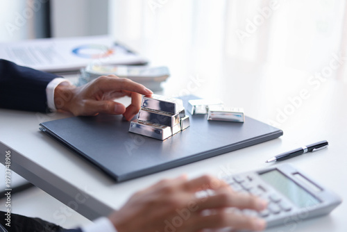 Silver Trading Businessman invest in trading silver, calculating profit price of  buying and selling silver in the market.