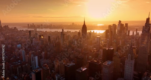 New York panorama covered with soft light of sunset. Golden hour drone footage over metropolis.