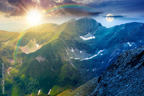 day meet night. mountain scenery on summer solstice. sun and moon over gorgeous mountainous landscape. background with rocky cliffs and grassy hillsides under a epic sky. ridge of southern mountains