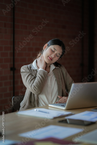 Asian female is demonstrating suffering from neck pain