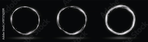 Three glowing elliptical light trails on a dark background