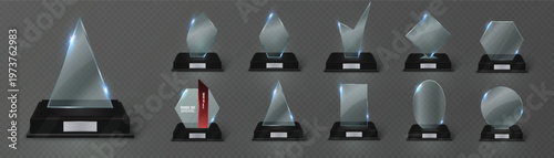 Collection of modern awards and trophies on dark background
