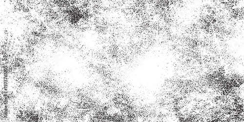 Abstract speckled texture background in black and white with a gritty feel with high contrast