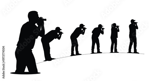 Group of photographers holding cameras up to eyes in silhouette style