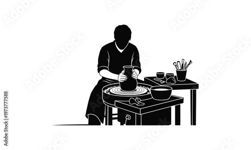 A potter crafting on a wheel in a workshop setting