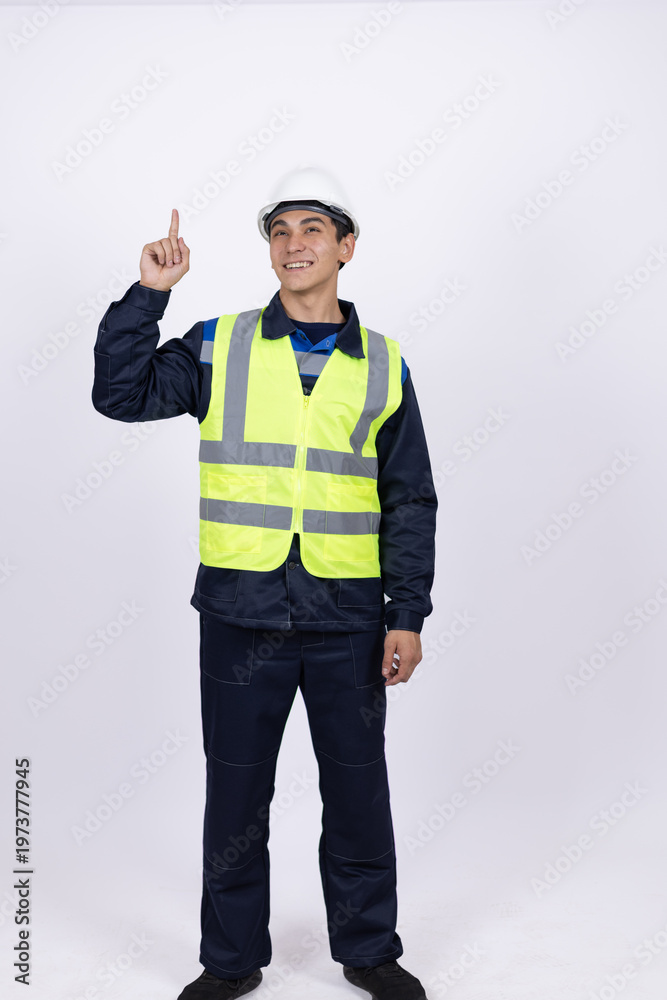 Fototapeta premium Builder in safety vest pointing finger up